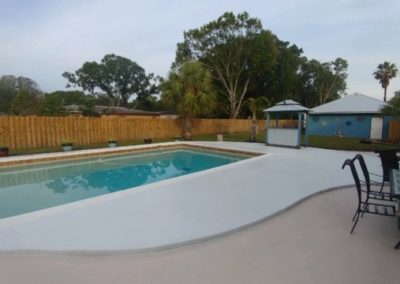 Image of a pool deck after repairs were made by RW Macy Concrete Construction, Inc.